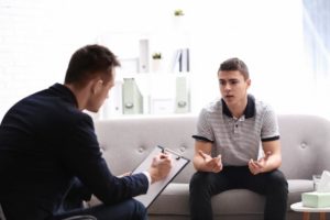 teen talking to a therapist about dialectical behavior therapy