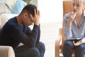teen upset in a trauma therapy session