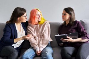 a teen and their parent benefit from family therapy for teen mental health